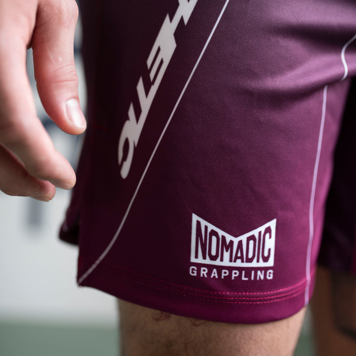 AESTHETIC Merlot ADCC 2026 Jozef Chen Combat Shorts - nomadic logo close up